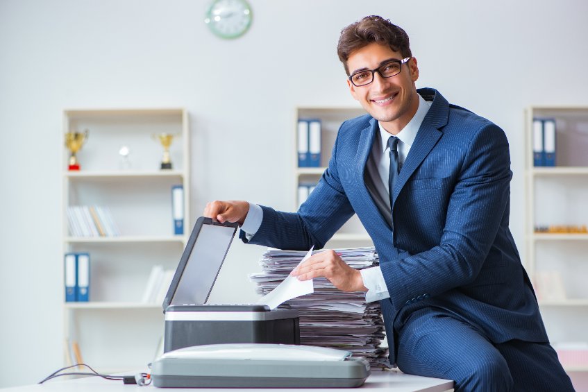 man in suit photocopying